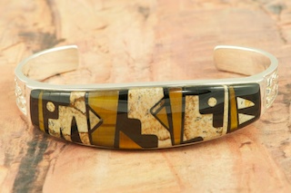 Stunning Silver work on the side on this Fabulous Bracelet! Genuine Picture Jasper and Black Jade set in heavy gauge Sterling Silver Bracelet. Designed by Navajo Artist Calvin Begay. Signed by the Artist.